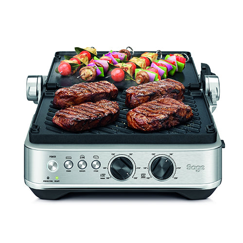 Sage the BBQ & Press Grill opened flat in BBQ mode with steaks and vegetable skewers, official view