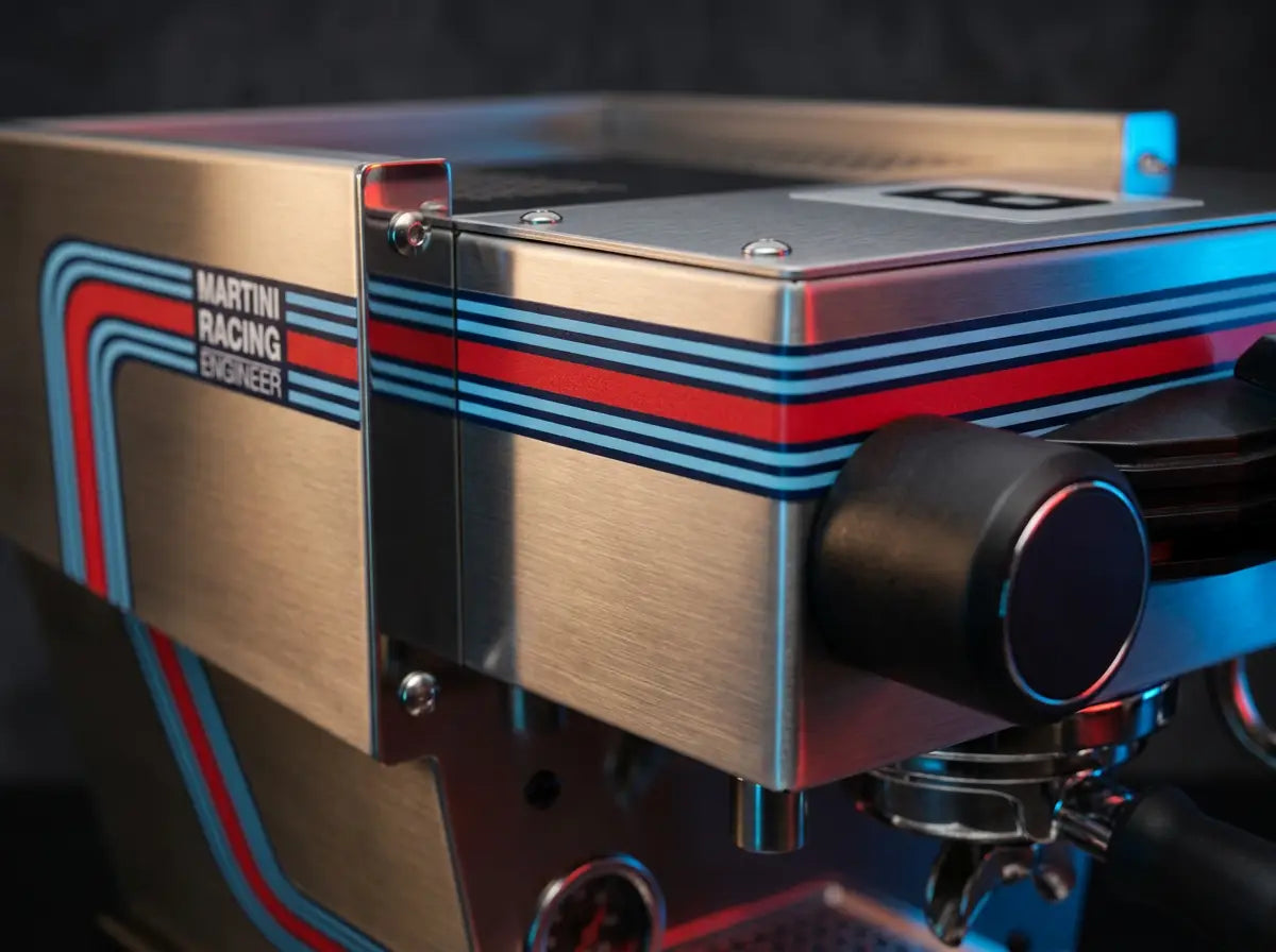 Close-up of the brushed metal body and blue-red racing livery