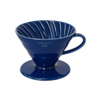 Hario V60-02 Dripper — Ceramic / Indigo Blue; consistent elevated view, square transparent image