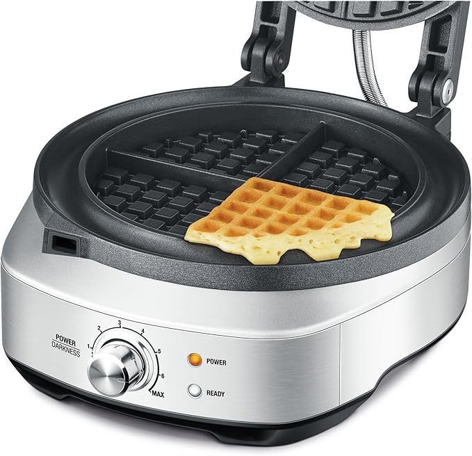 Sage the No-mess Waffle open with a golden Belgian waffle on the round plate and the overflow moat around it, official view